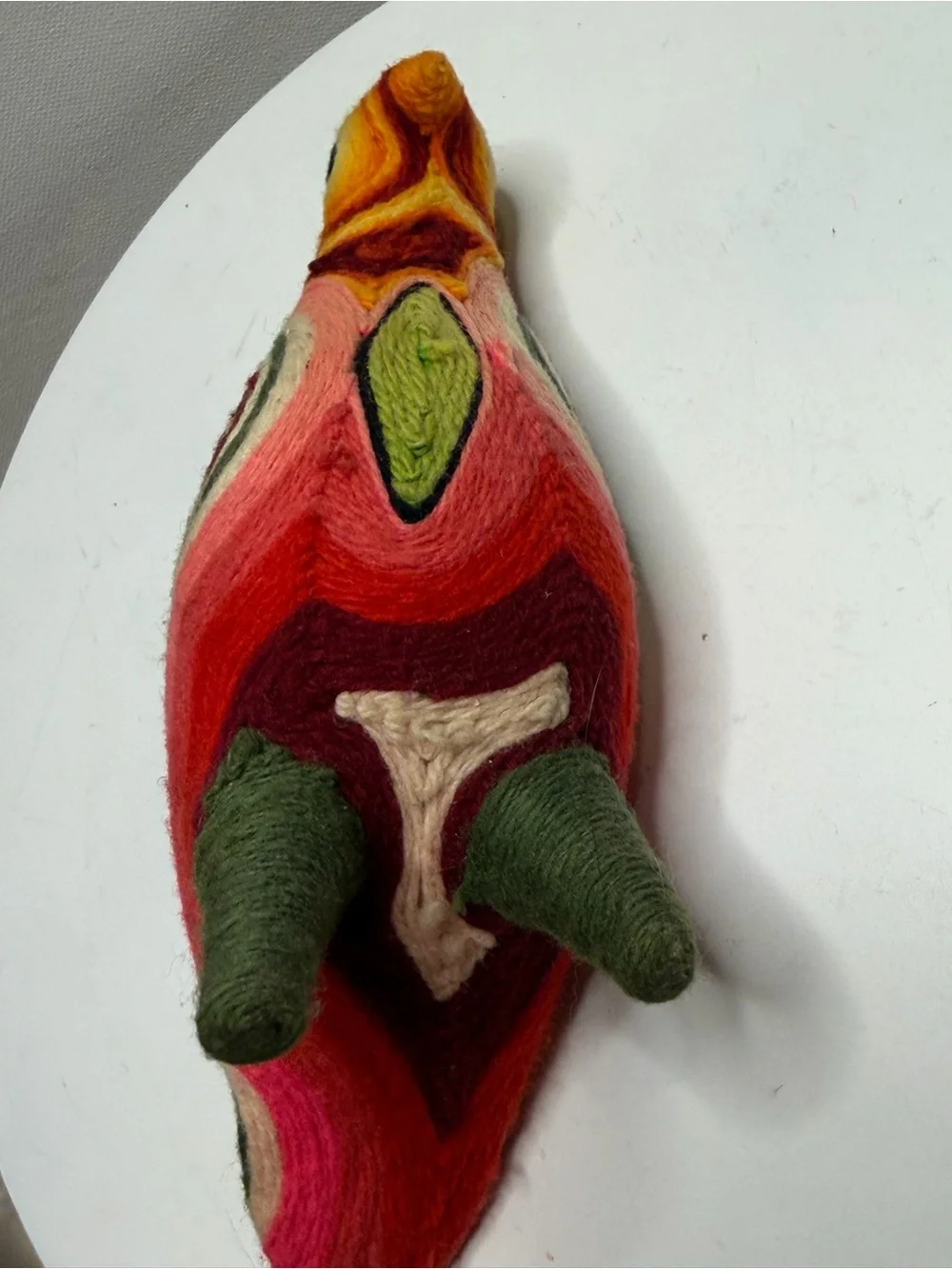 traditional bird figurine in the Huichol yarn art style